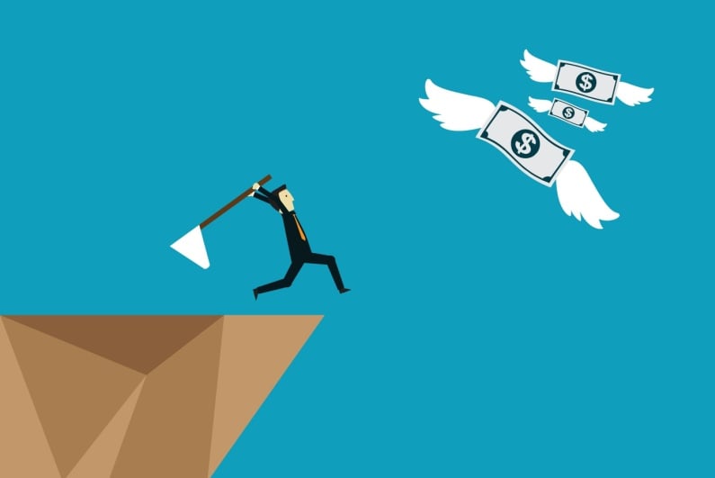 Man chasing flying money off a cliff