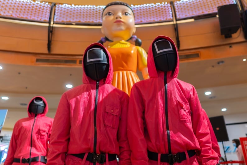 People dressed as Squid Game characters for promo