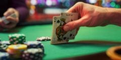 Poker player with K-Q hole cards