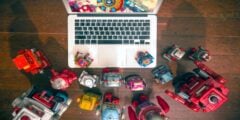 Toy robots watching movie on laptop