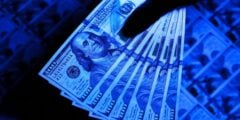 Checking for counterfeit bills with UV light